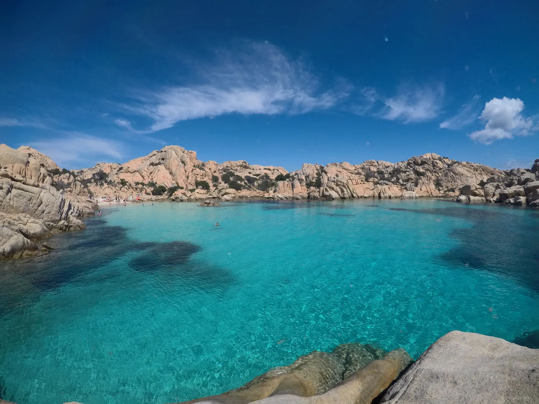 Explore the breathtaking blue waters and rocky landscapes of La Maddalena, Italy, a true paradise.